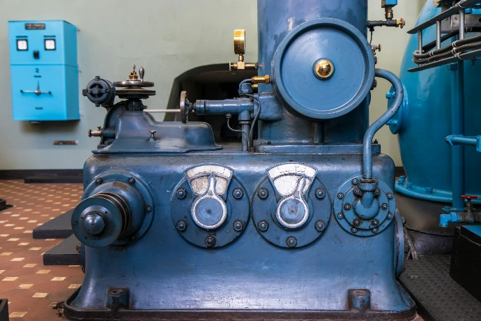 A large blue machine sitting inside of a building